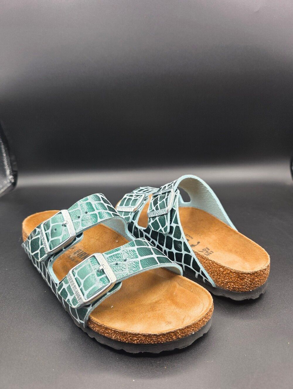 Birkenstock Arizona Gator Gleam sandals in the Ocean Breeze metallic green color